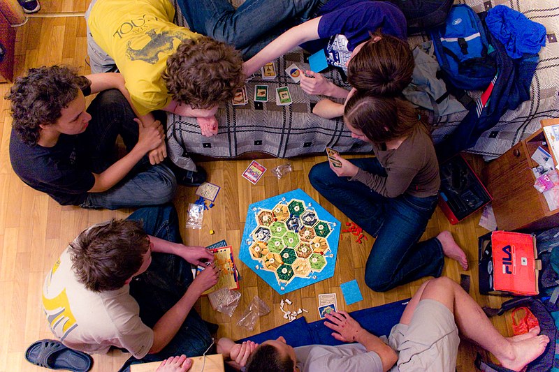 people playing catan