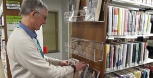Volunteer Bob Gibson helps keep order and an upbeat environment