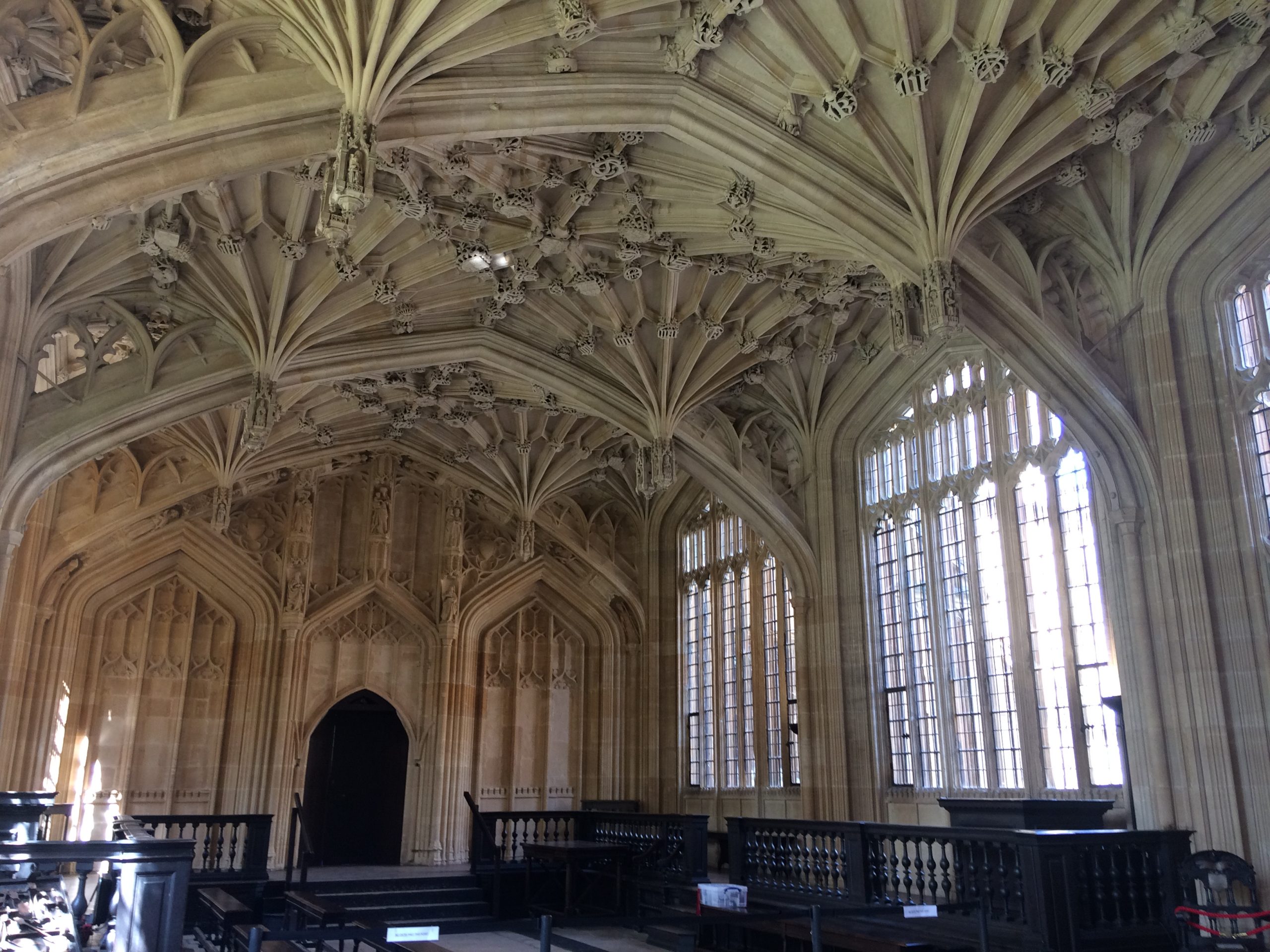 interior of room with large windows and vaulted ceiling