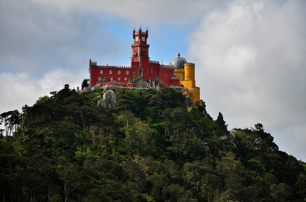 "Pena Palace from Moorish Castle Royal Tower" by tonyfernandezz is licensed under CC BY-NC 2.0