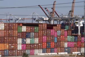 Cargo containers sit stacked at the Port of Los Angeles in San Pedro, Calif., Tuesday, Oct. 19, 2021. (AP Photo/Damian Dovarganes)